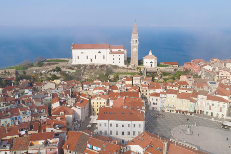 Aerial view of Piran with Saint George's Cathedral and Tartini Square