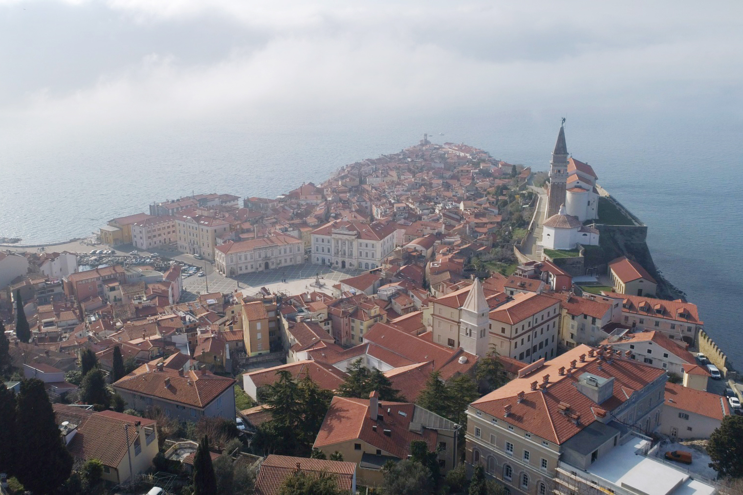 Aerial view of Piran with Saint George's Cathedral and Tartini Square